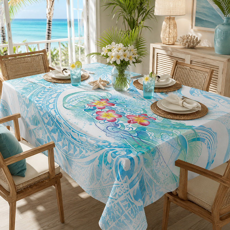 Table setting with a floral tablecloth in a beach-themed room with ocean view.