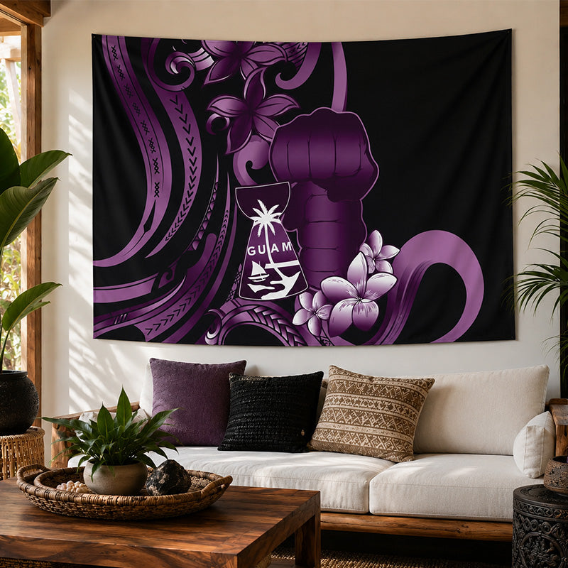 Decorative tapestry with Guam design on a wall above a couch in a living room.